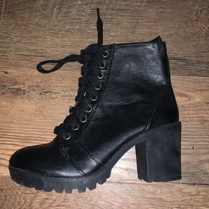 Black heeled zip up boots